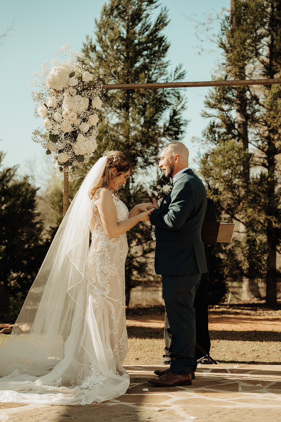 Spring wedding at Cold Creek Farm with rain plan in action, showing happy guests under umbrellas and a cozy barn ceremony.