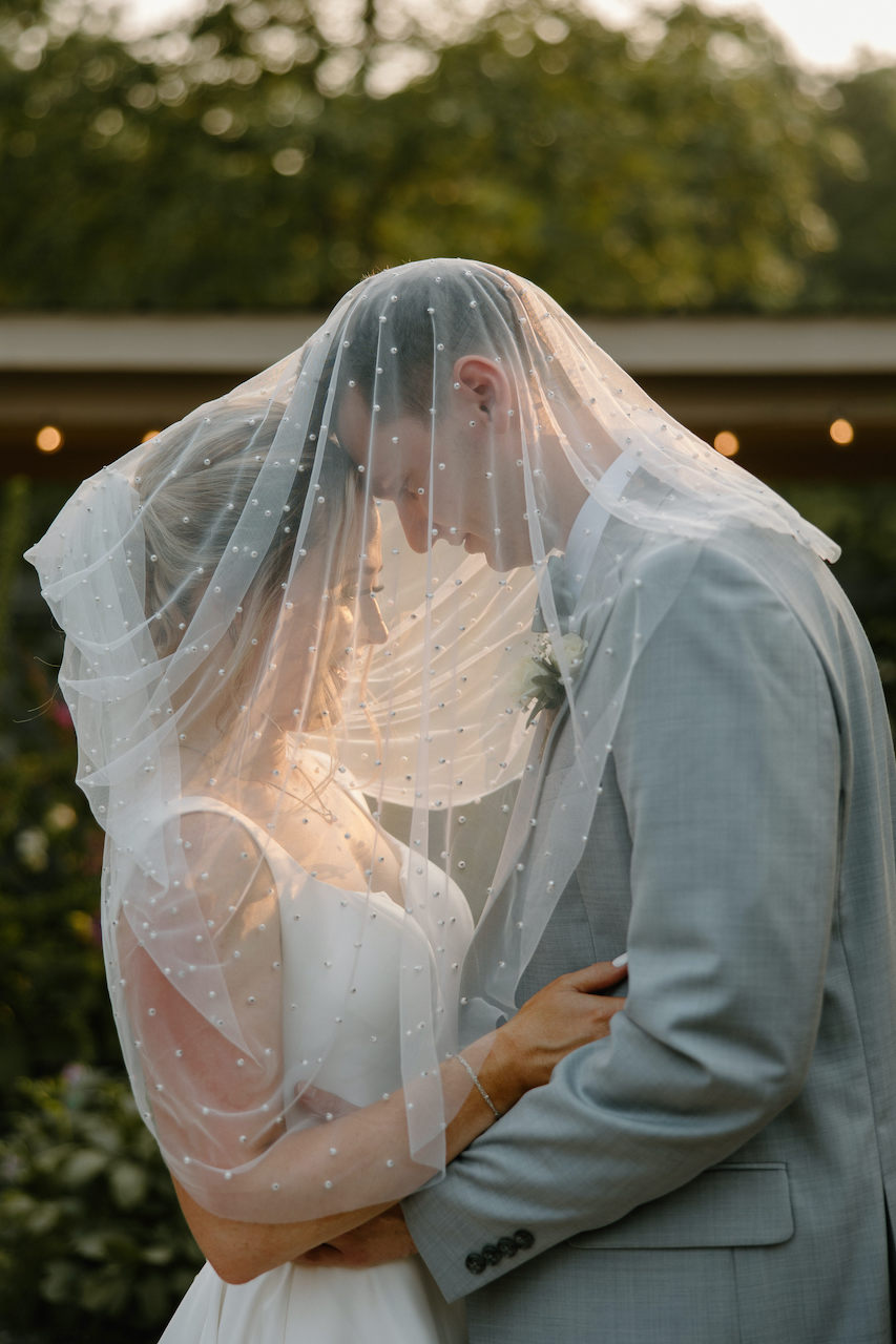 Veiled Couple Wedding Photo